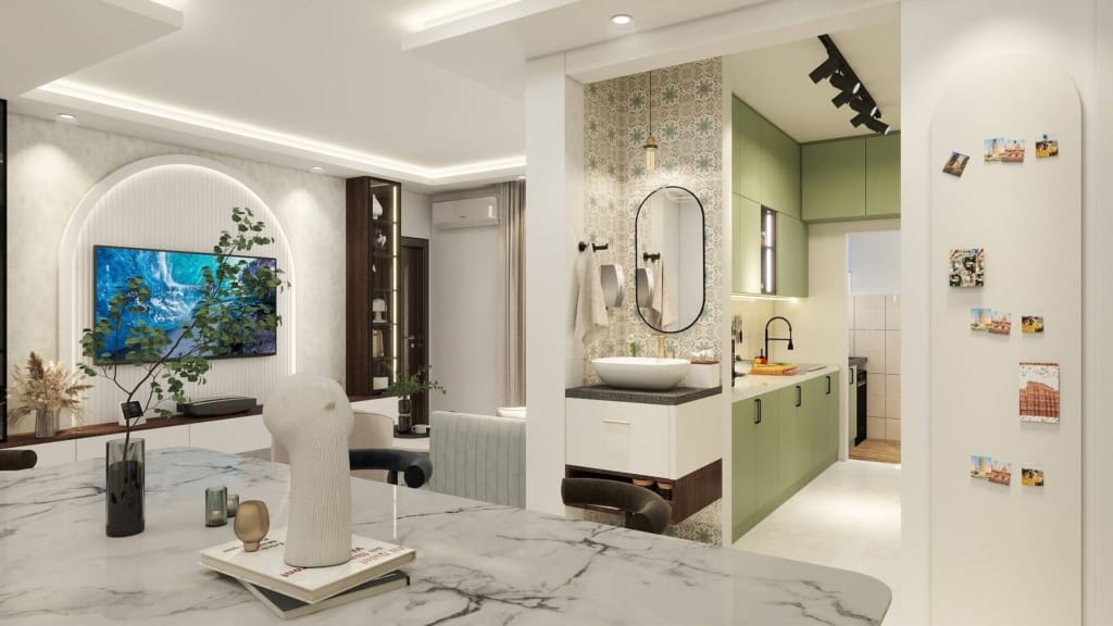 Modern open-plan living, dining, and kitchen interior with green cabinets, marble table, wall-mounted TV, and stylish decor elements.