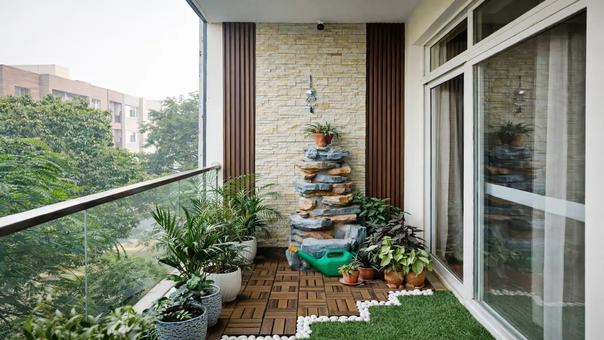 Modern small balcony makeover with wooden decking, vertical garden wall and built-in seating in apartment