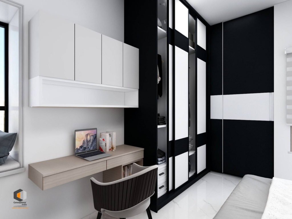 Modern bedroom with a sleek modular wardrobe, minimalist study desk, overhead storage cabinets, and clean monochrome design